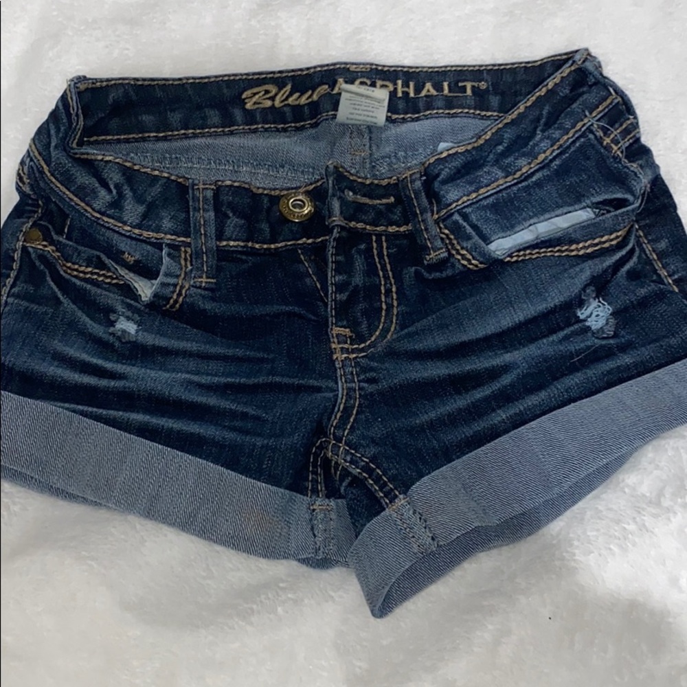 Dark wash jean shorts.